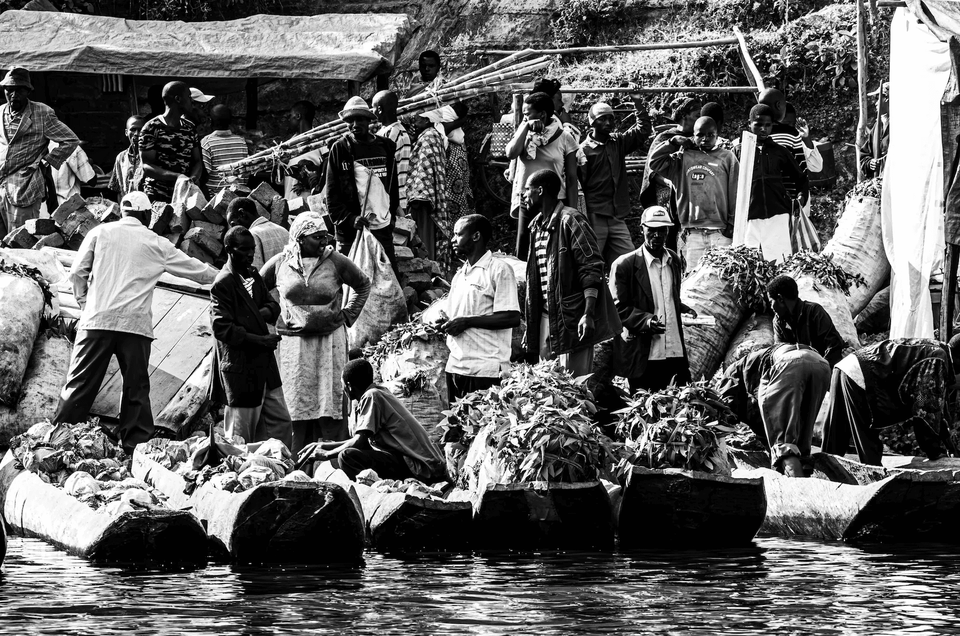 Black and white tea market scene on the shore of Lake Bunyonyi, Uganda.