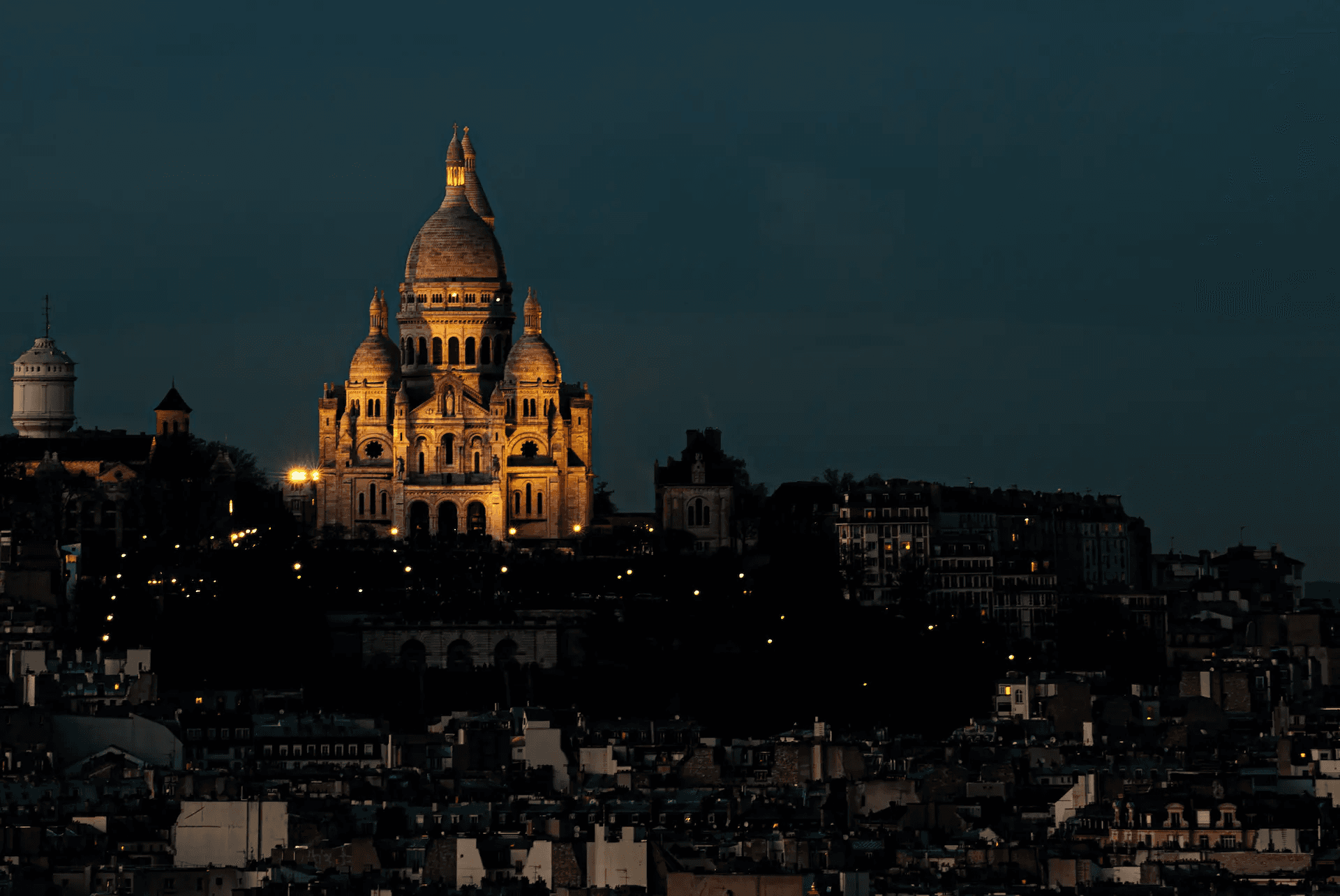 Sacré-Cœur at Night Parisian Illumination in Paris in architectural light.