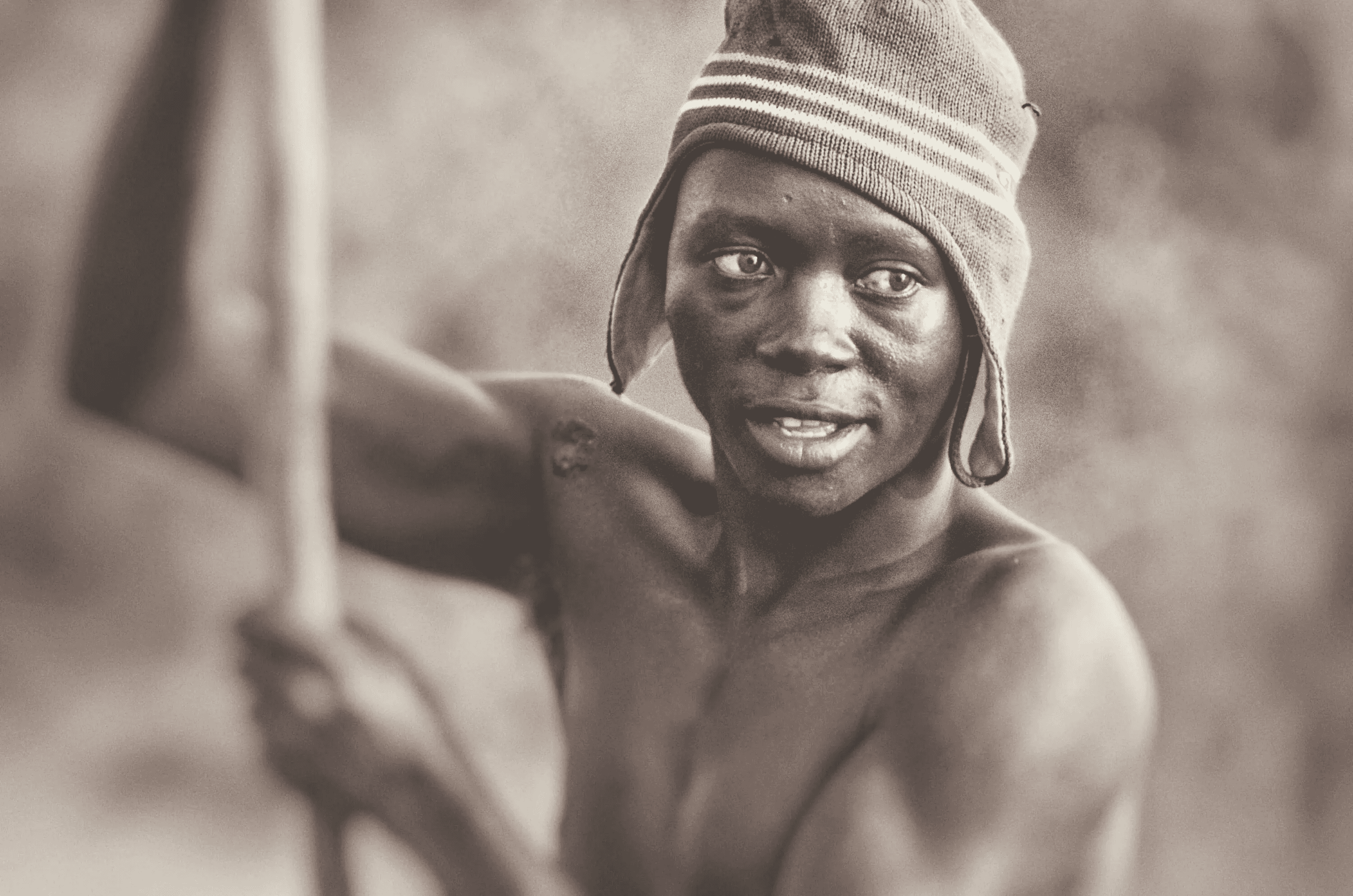 Portrait of a Ugandan Fisherman Close-up, sepia-toned portrait photograph of a Ugandan fisherman.