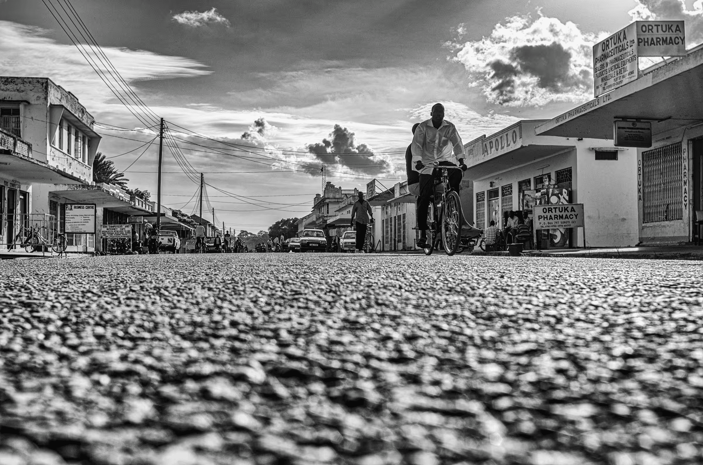 Black and white street scene photograph in Ortuka, Northern Uganda.