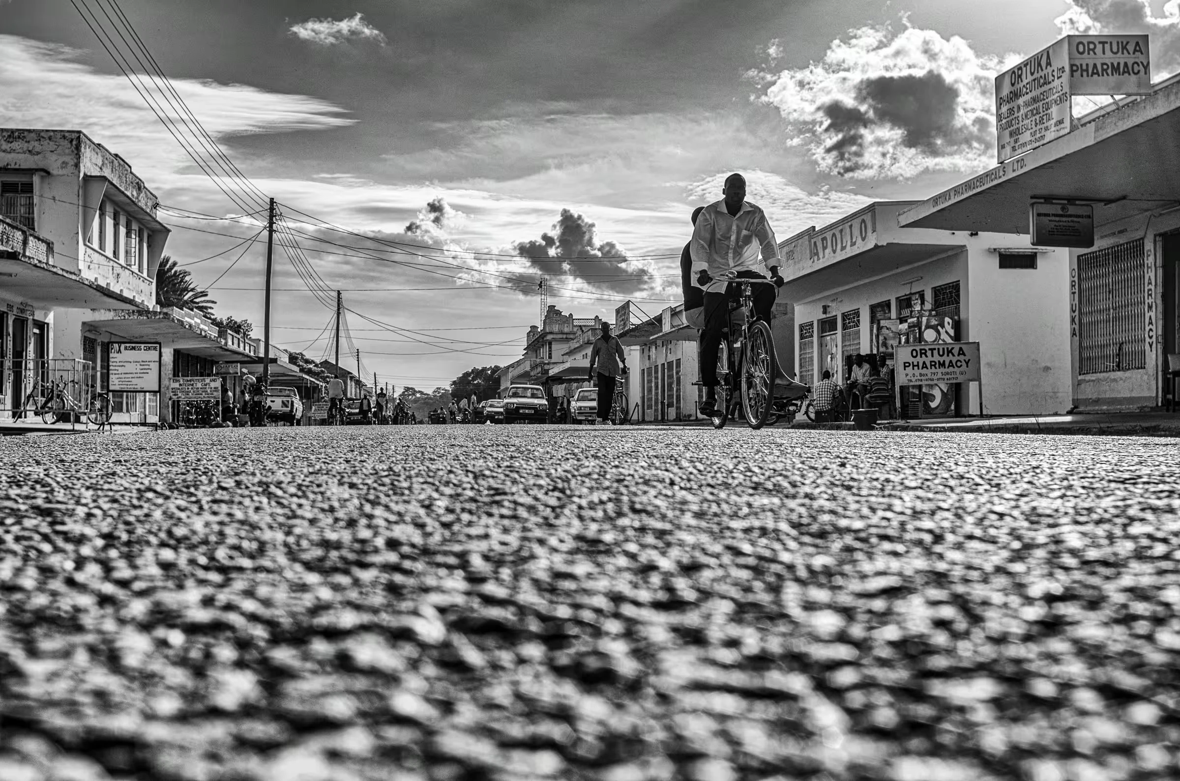 Black and white street scene photograph in Ortuka, Northern Uganda.