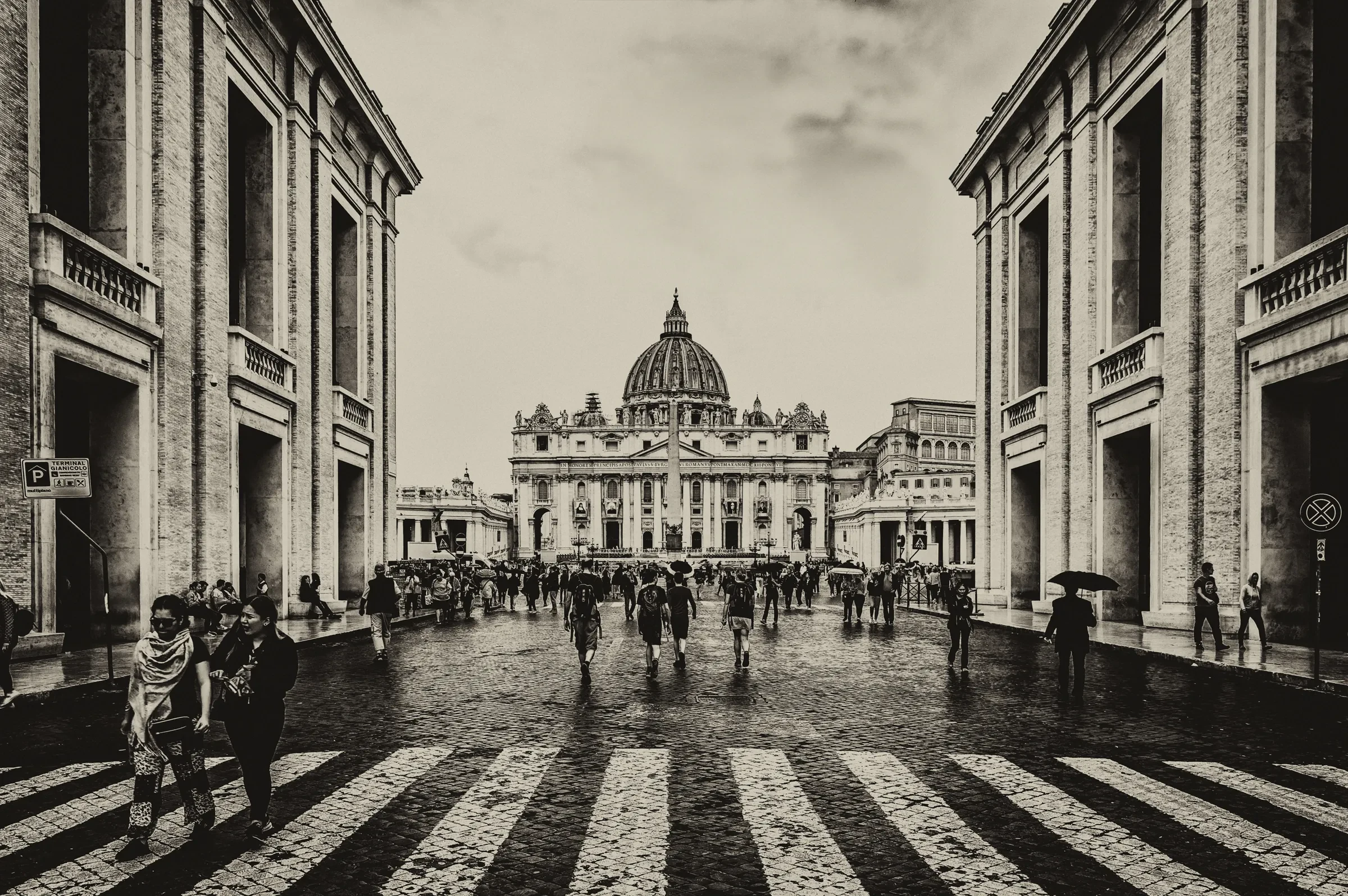 Monochrome photograph looking down the Via della Conciliazione towards St.