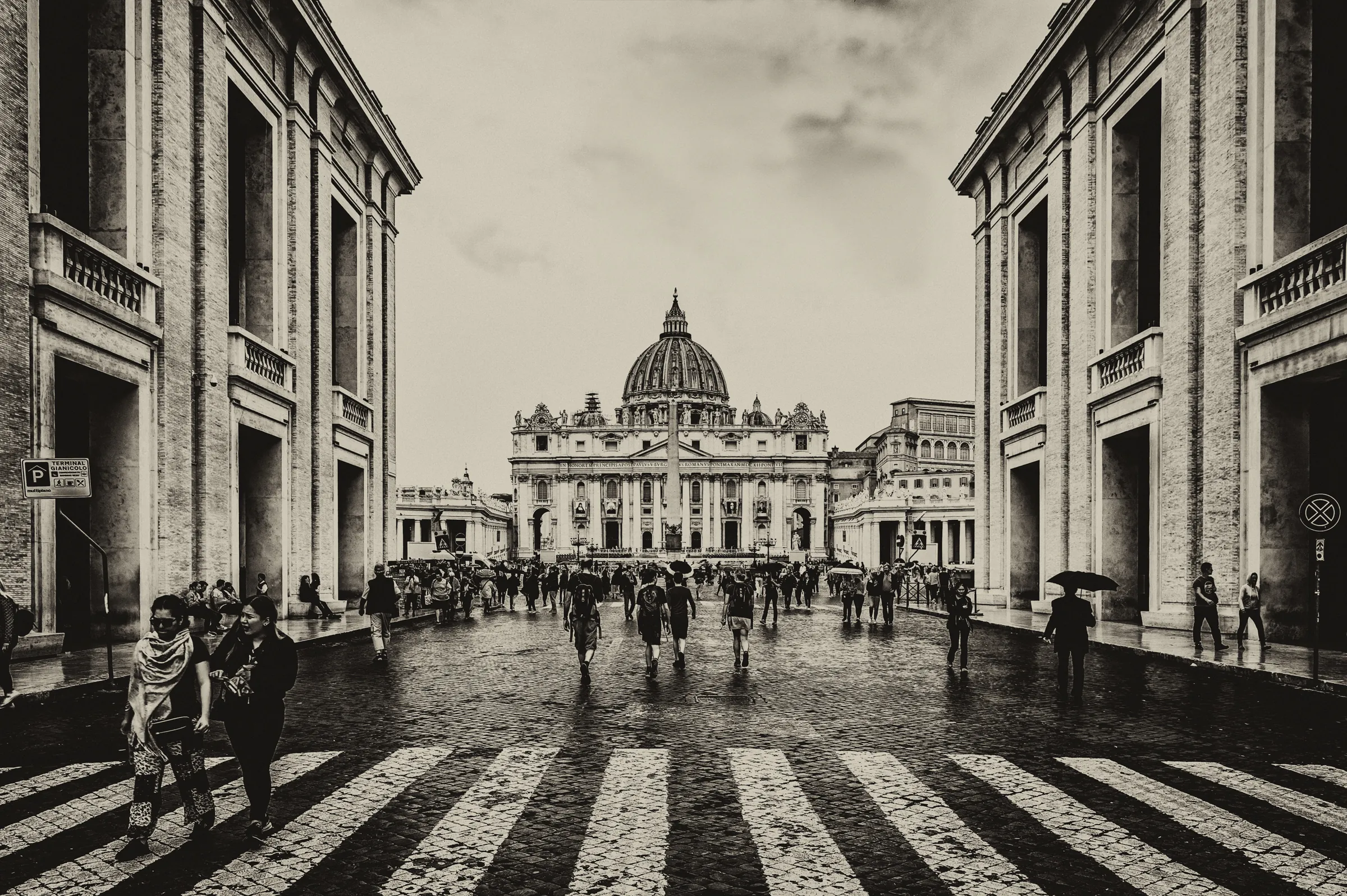 Monochrome photograph looking down the Via della Conciliazione towards St.