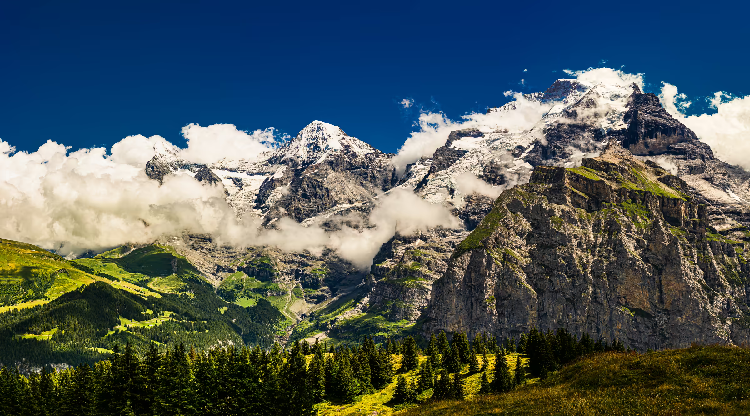 Eiger, Mönch, and Jungfrau mountains in the Swiss Alps.